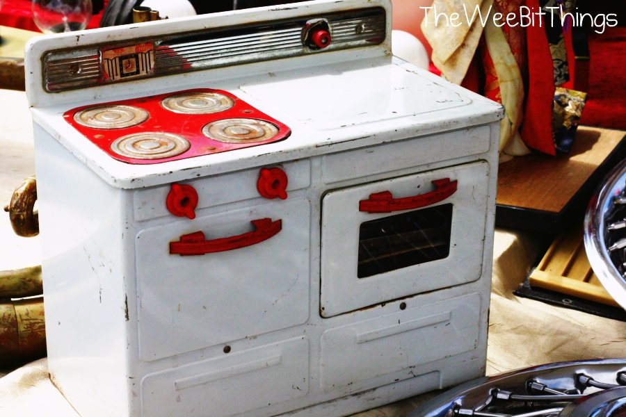 vintage toy stove in classic red and white