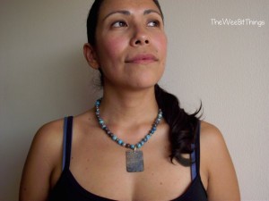 Model wearing blue beaded necklace
