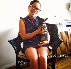 Photo image of woman sitting with her chihuahua on her lap